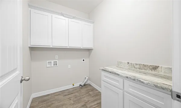 a bathroom with a sink and cabinets