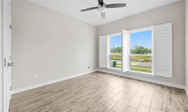 a view of room with window and hardwood floor