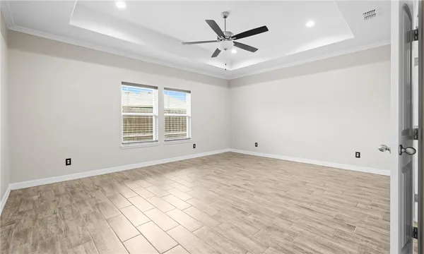 a view of a livingroom with a ceiling fan and window
