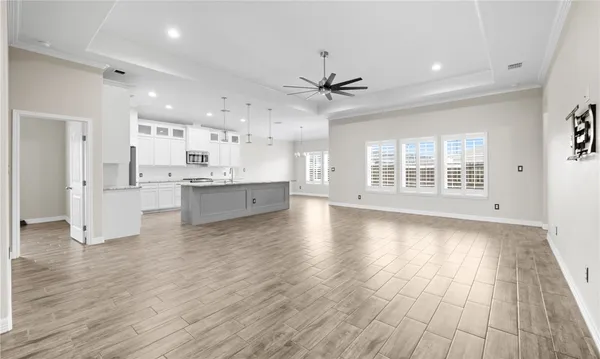 a view of kitchen with wooden floor and window
