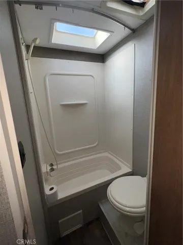 a room with window and hardwood