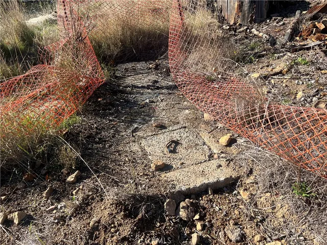 an aerial view of residential house with an outdoor space