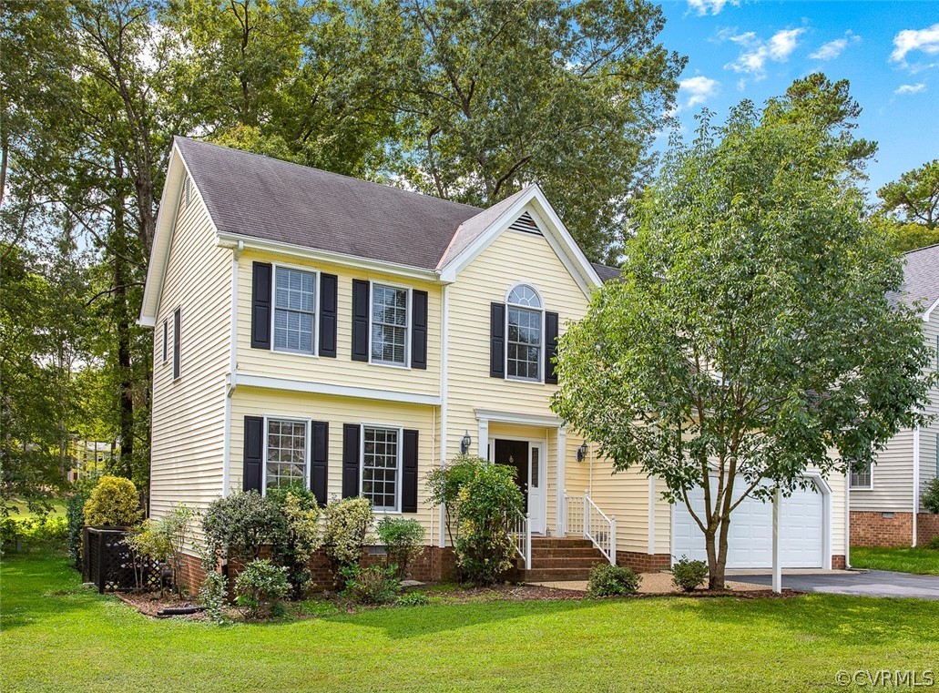 13902 Sagebrook Road Midlothian, VA 23112 - Photo 1 of 37 a front view of a house with a garden and plants