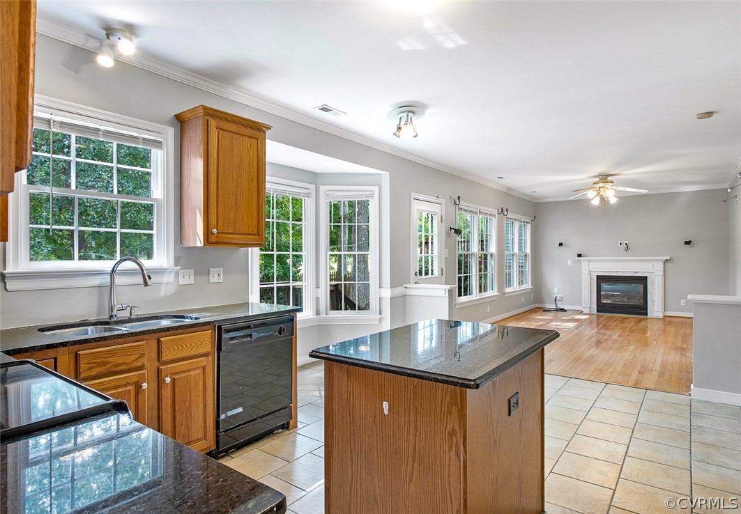 13902 Sagebrook Road Midlothian, VA 23112 - Photo 11 of 37 a kitchen with granite countertop a sink stove and cabinets