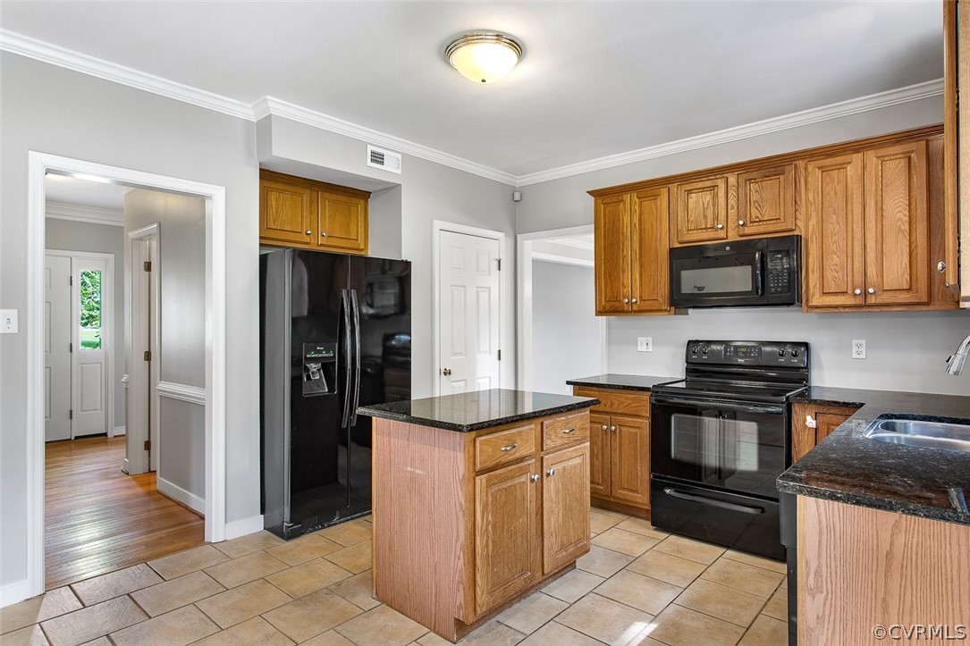 13902 Sagebrook Road Midlothian, VA 23112 - Photo 10 of 37 a kitchen with stainless steel appliances granite countertop a stove and a refrigerator