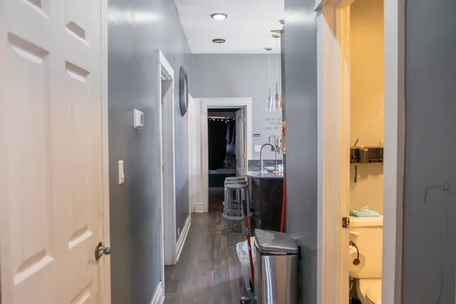 a bathroom with a sink toilet a mirror and tub