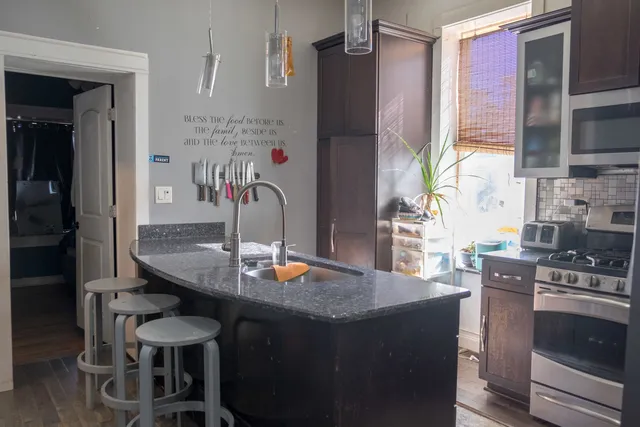 a very nice looking dining room with a table chairs and a clock