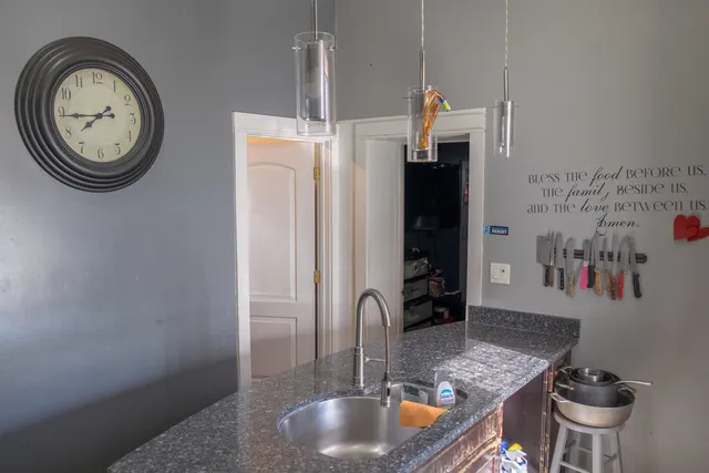 a kitchen with stainless steel appliances and a refrigerator