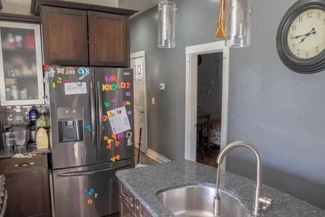 a bedroom with a bed and chair