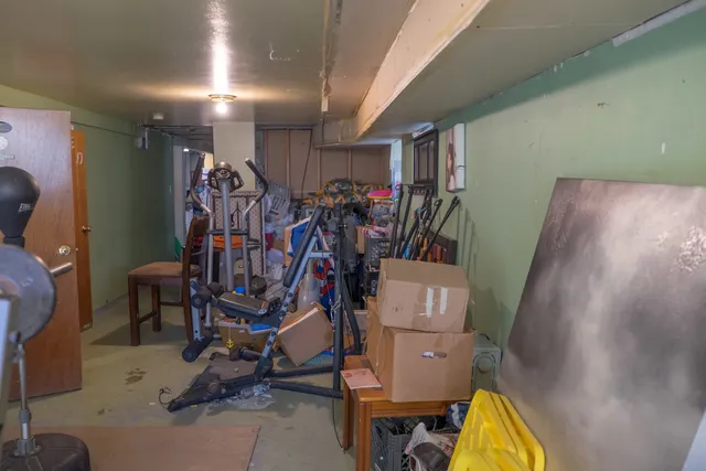 a bedroom with a bed and furniture