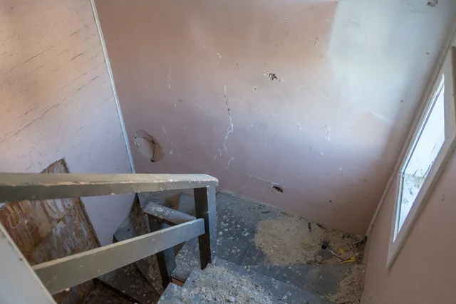 a front view of a house with a glass windows