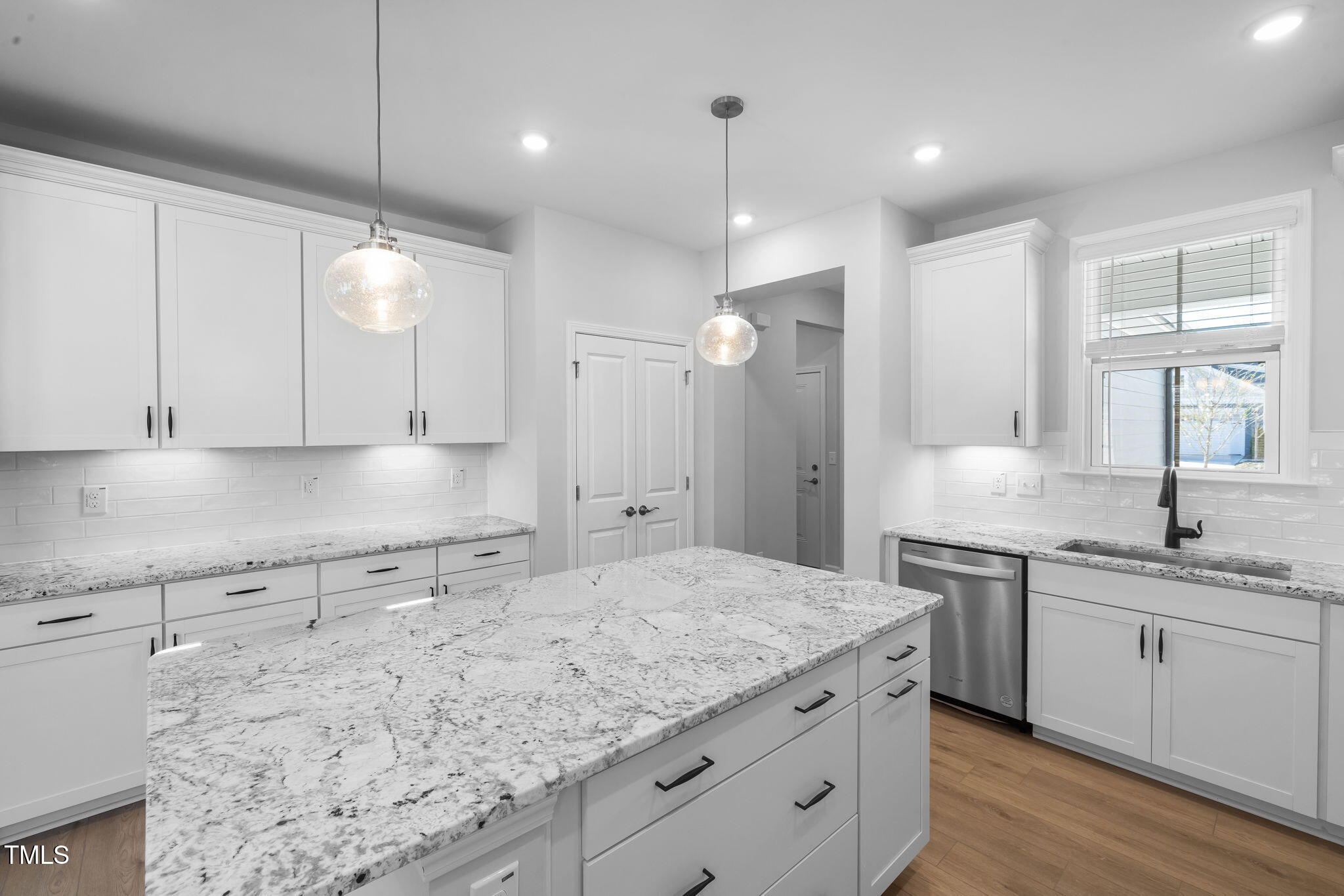 173 Churchill Way Clayton, NC 27520 - Photo 4 of 25 a kitchen with a sink stove and cabinets