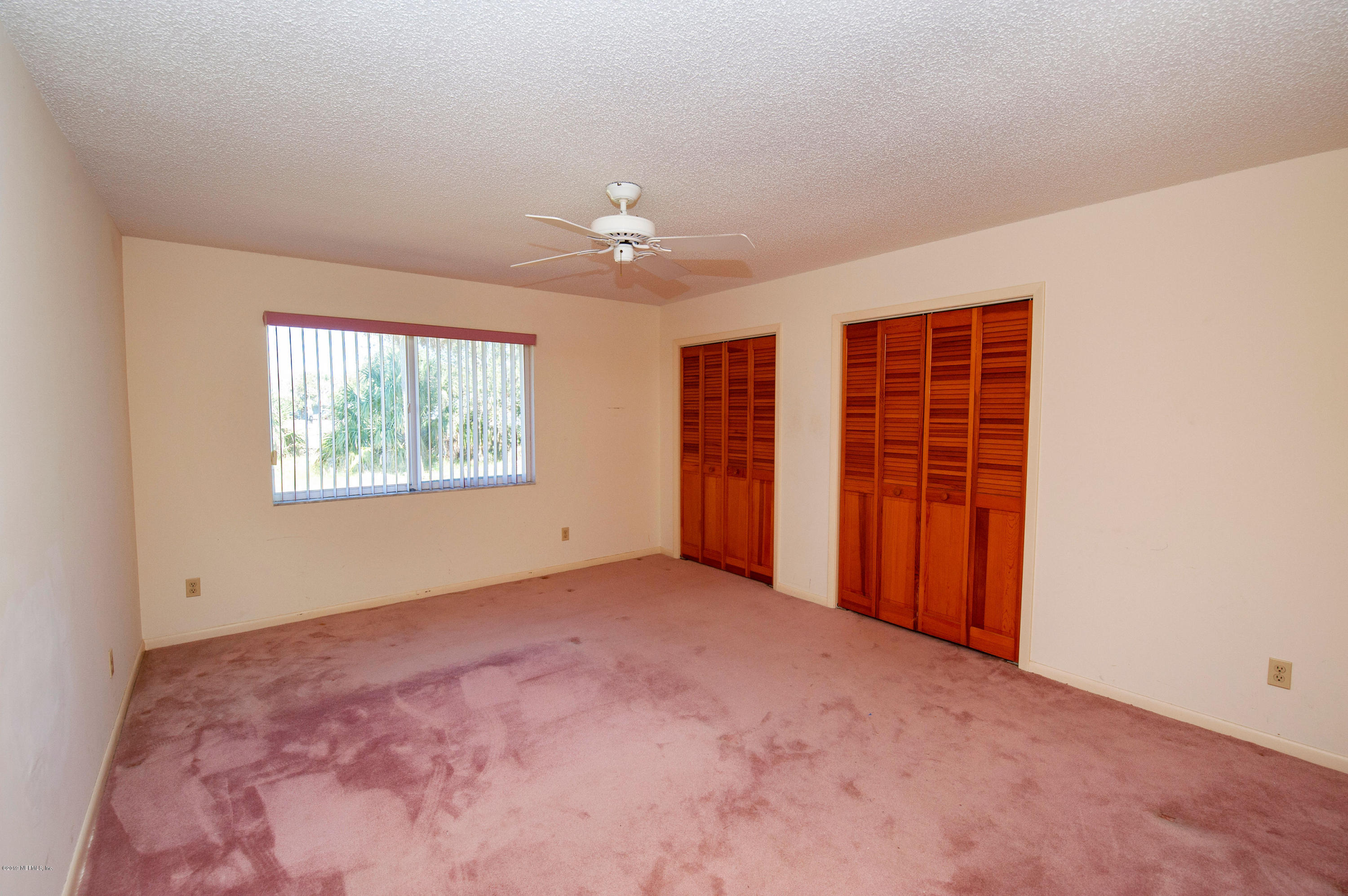 6333 Salado Road St. Augustine, FL 32080 - Photo 20 of 33 an empty room with windows and closet