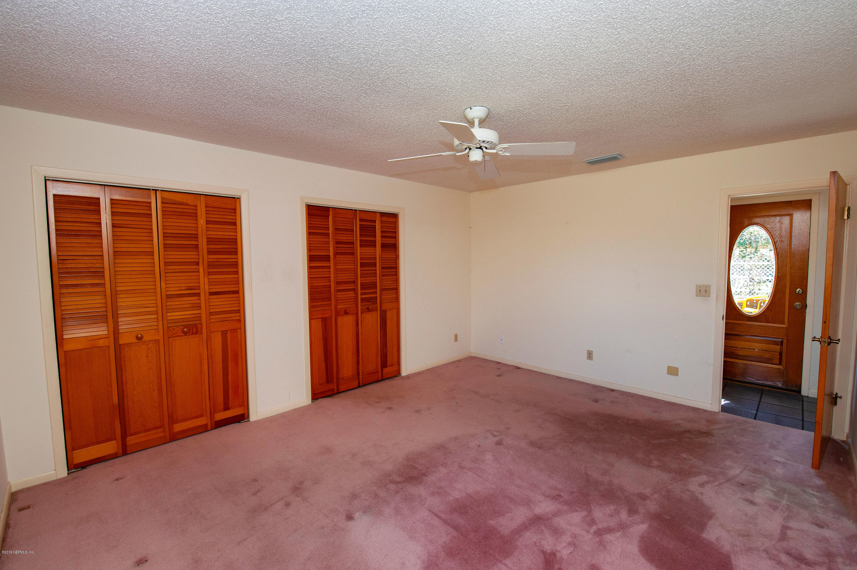 6333 Salado Road St. Augustine, FL 32080 - Photo 21 of 33 an empty room with closet closet and fan