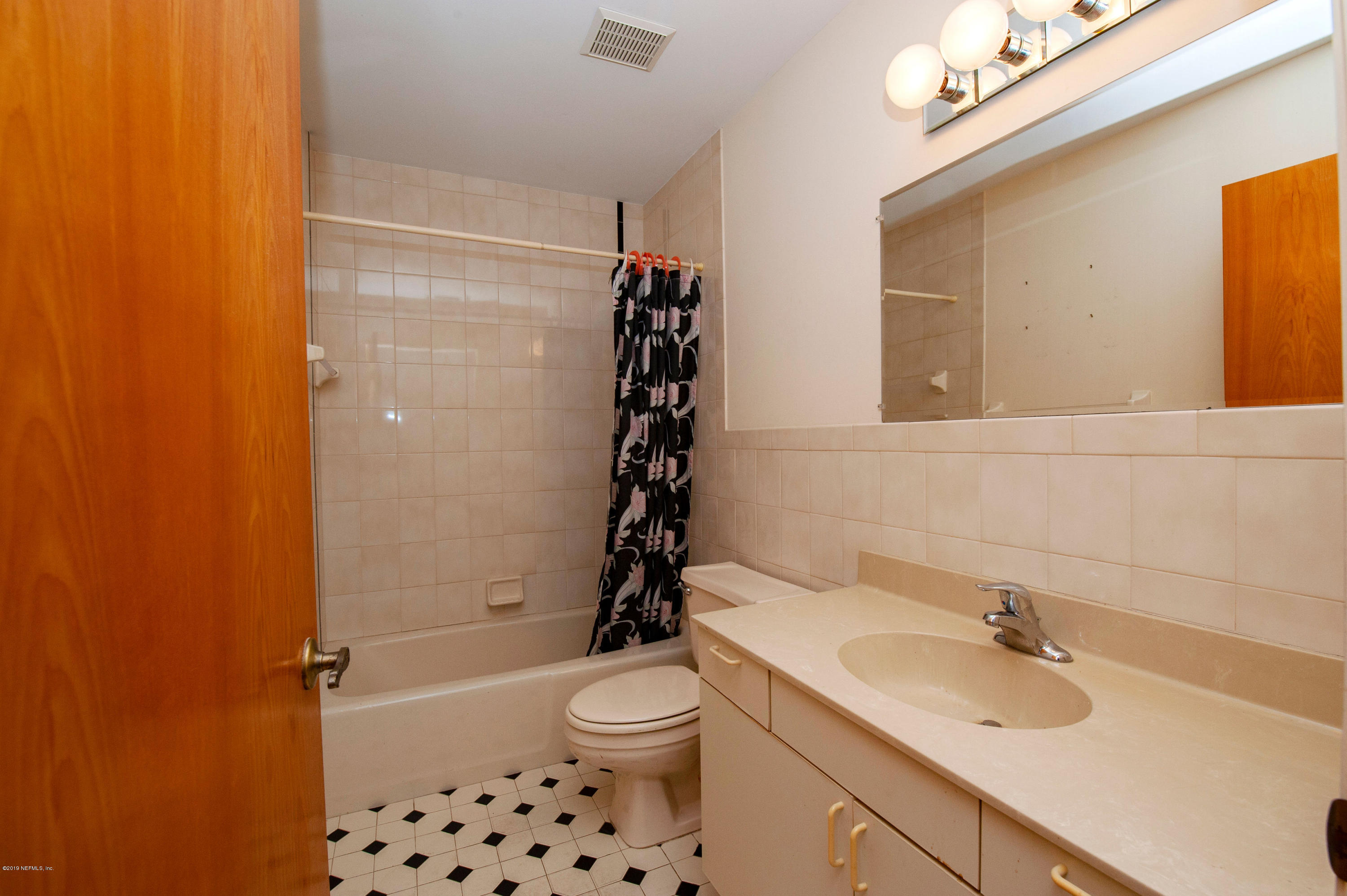 6333 Salado Road St. Augustine, FL 32080 - Photo 22 of 33 a bathroom with a sink a toilet and shower