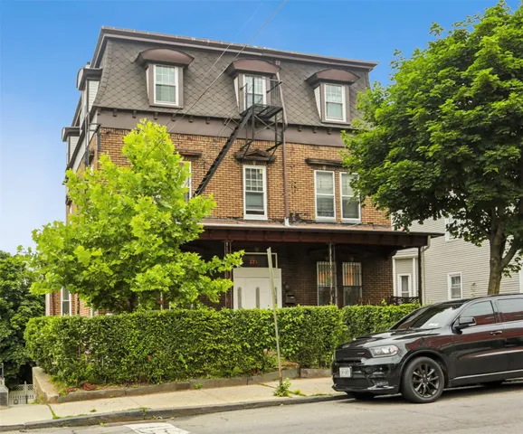 a car parked in front of a house