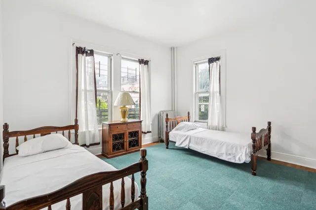 a bedroom with a bed and a table