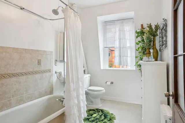 a bathroom with a toilet a sink and a bathtub