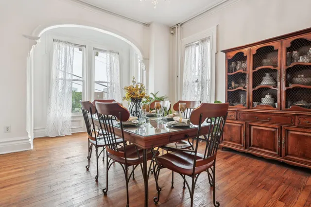 a view of a dining room with furniture window and wooden floor