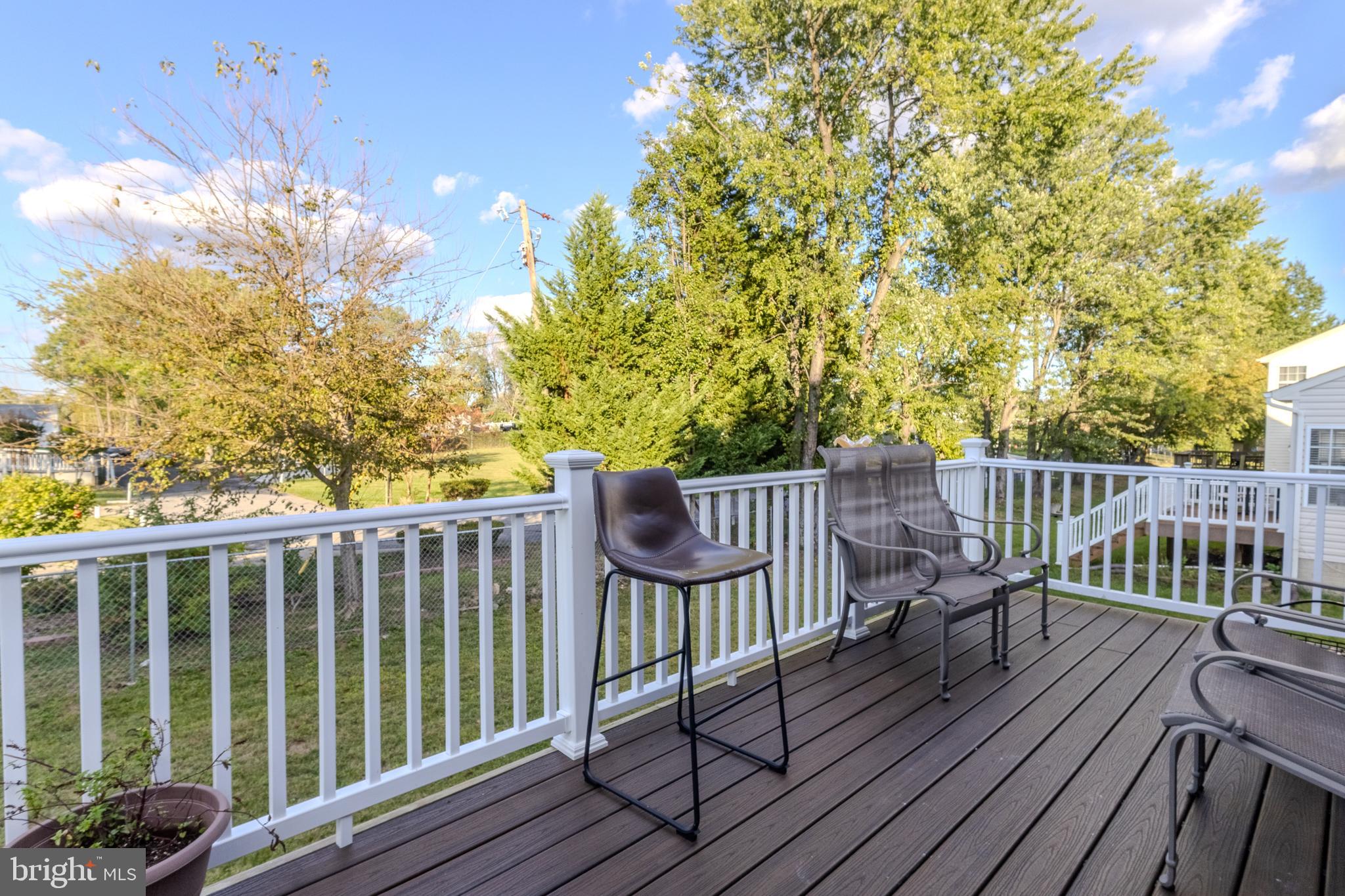 7530 Haystack Drive Windsor Mill, MD 21244 - Photo 11 of 30 a view of a chair in wooden deck