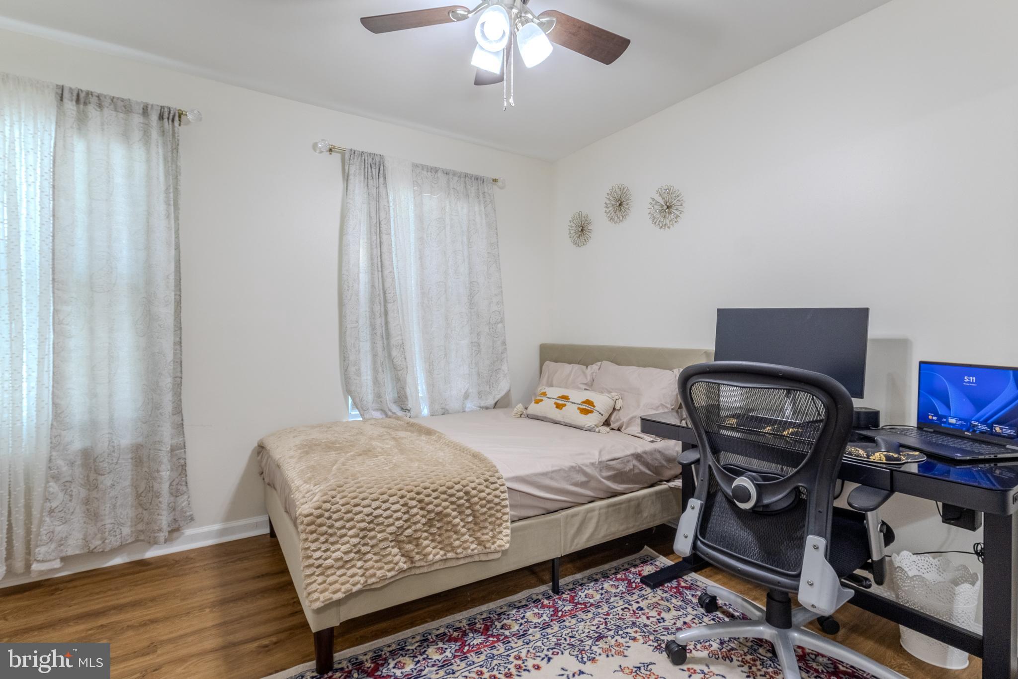 7530 Haystack Drive Windsor Mill, MD 21244 - Photo 14 of 30 a bedroom with a bed and a chair