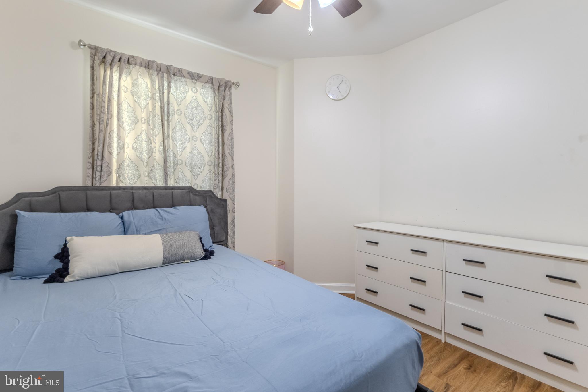 7530 Haystack Drive Windsor Mill, MD 21244 - Photo 17 of 30 a bedroom with a bed and window