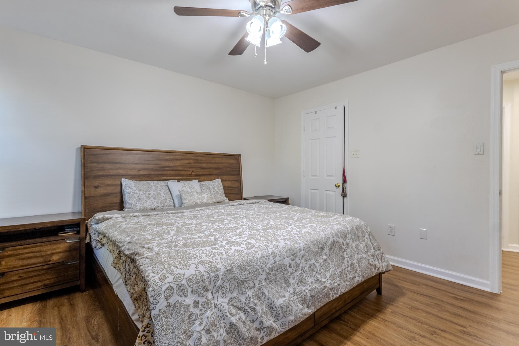 7530 Haystack Drive Windsor Mill, MD 21244 - Photo 20 of 30 a bedroom with a bed and a ceiling fan