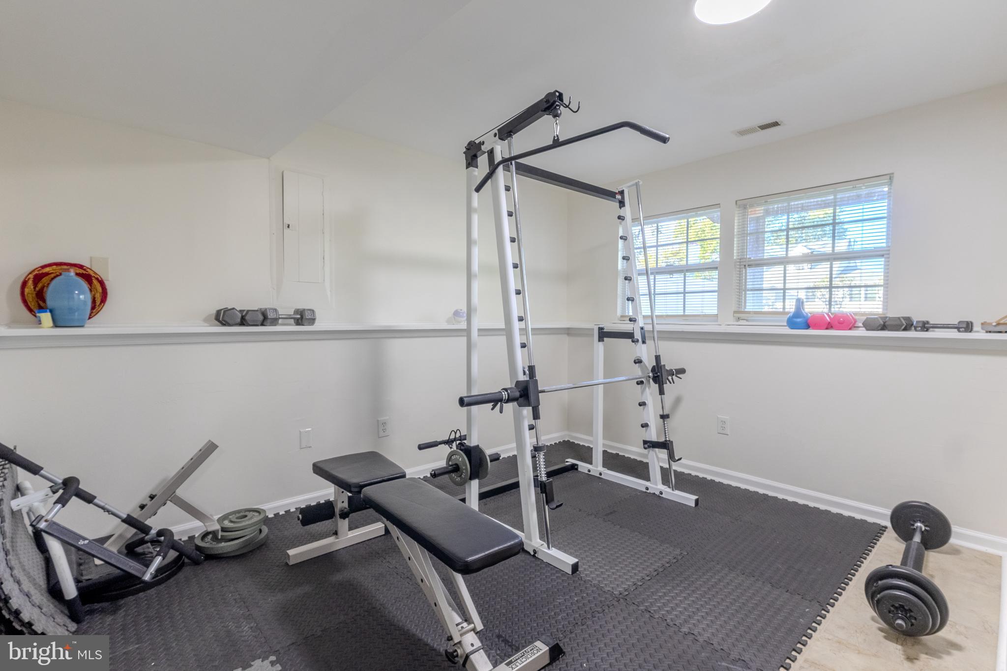 7530 Haystack Drive Windsor Mill, MD 21244 - Photo 23 of 30 a room with gym equipment and windows