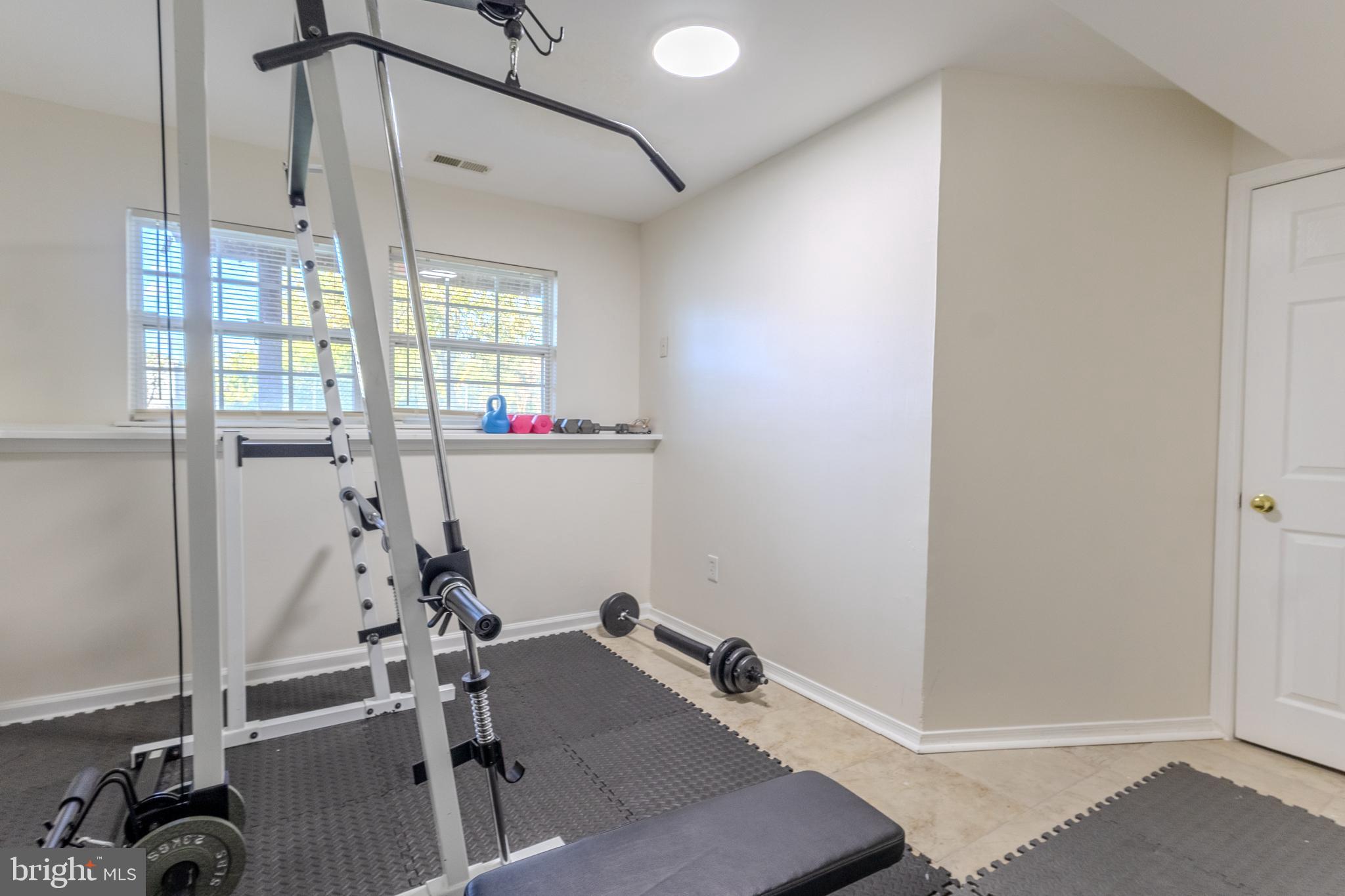 7530 Haystack Drive Windsor Mill, MD 21244 - Photo 24 of 30 a room with gym equipment and a window