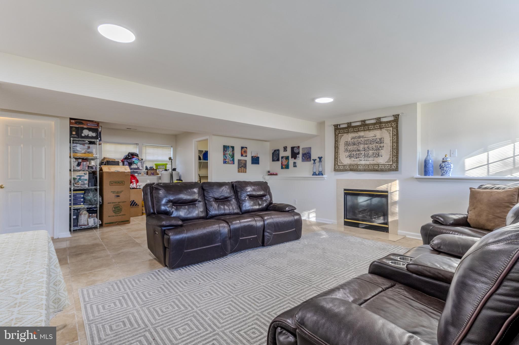 7530 Haystack Drive Windsor Mill, MD 21244 - Photo 26 of 30 a living room with furniture and a fireplace
