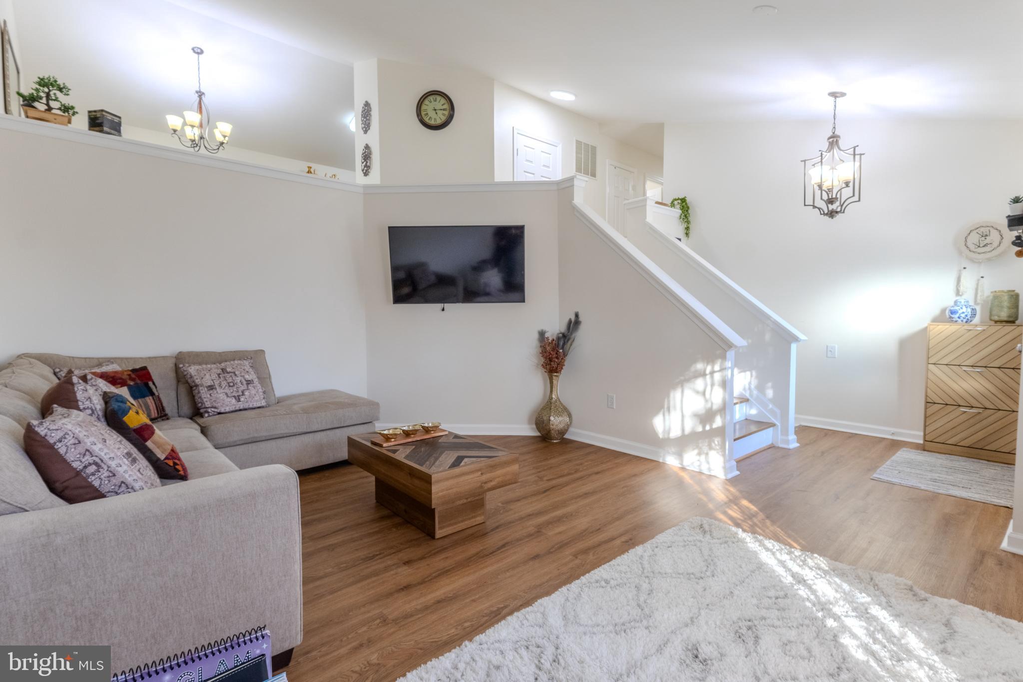 7530 Haystack Drive Windsor Mill, MD 21244 - Photo 4 of 30 a living room with furniture kitchen view and a flat screen tv