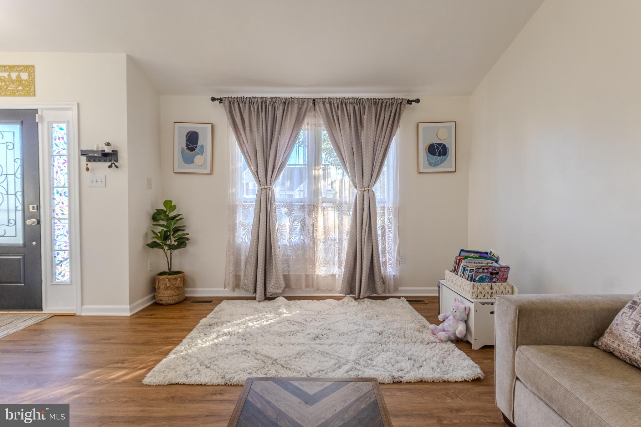 7530 Haystack Drive Windsor Mill, MD 21244 - Photo 5 of 30 a bedroom with a bed and a window