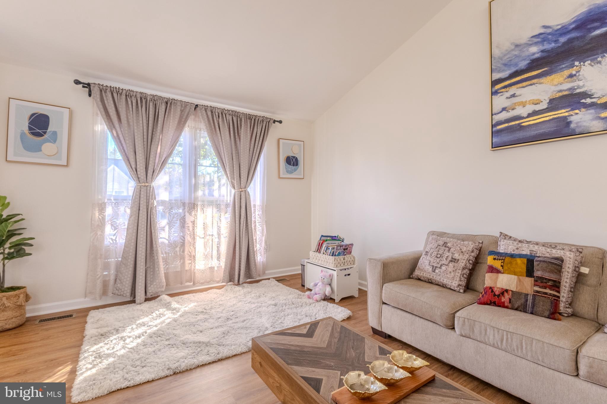 7530 Haystack Drive Windsor Mill, MD 21244 - Photo 6 of 30 a living room with furniture and a large window