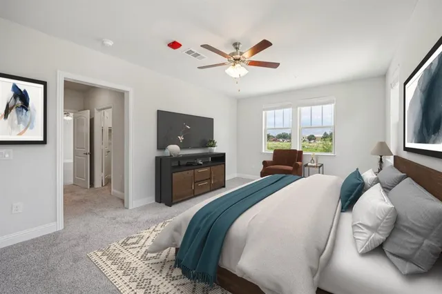 a bedroom with a bed dresser and a window