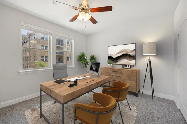 a workspace with furniture and window