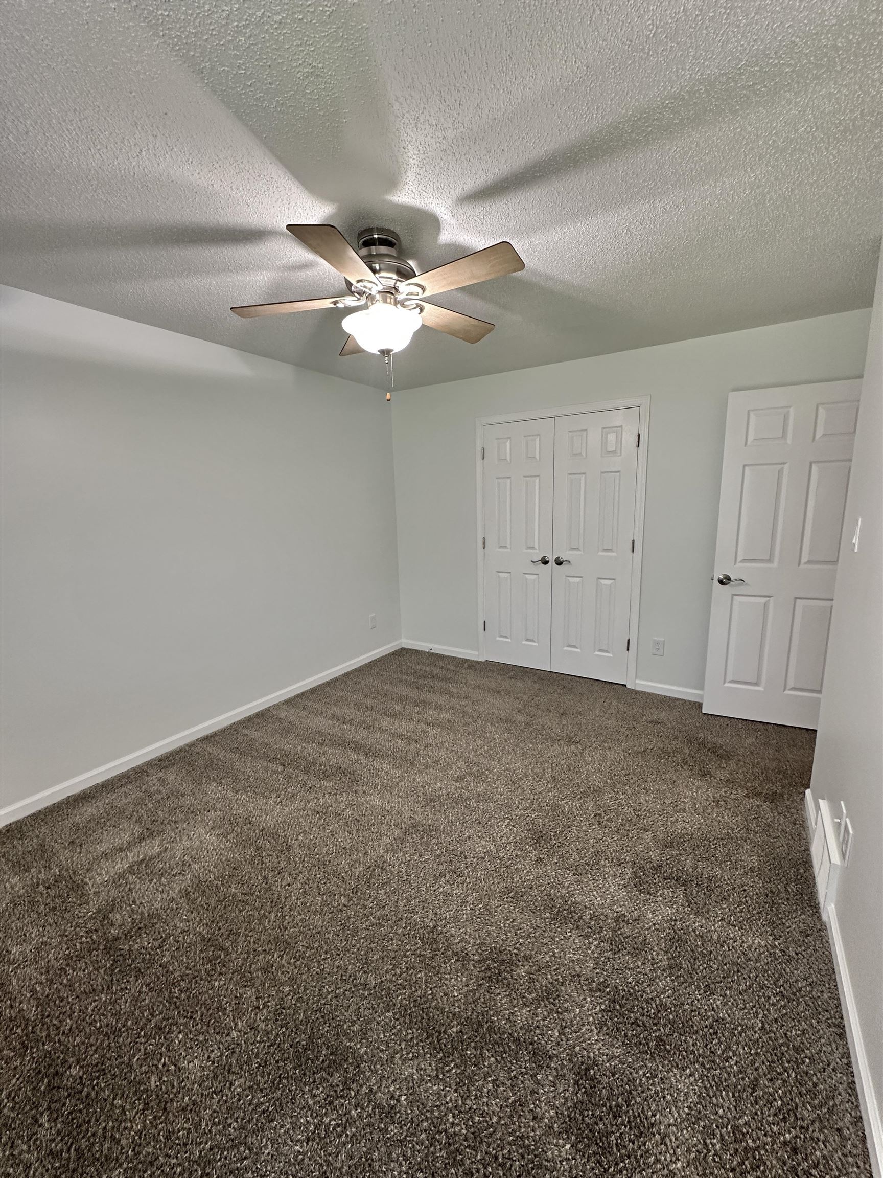 10006 Cameron Ridge Trail Memphis, TN 38016 - Photo 22 of 29 a view of a big room with carpet