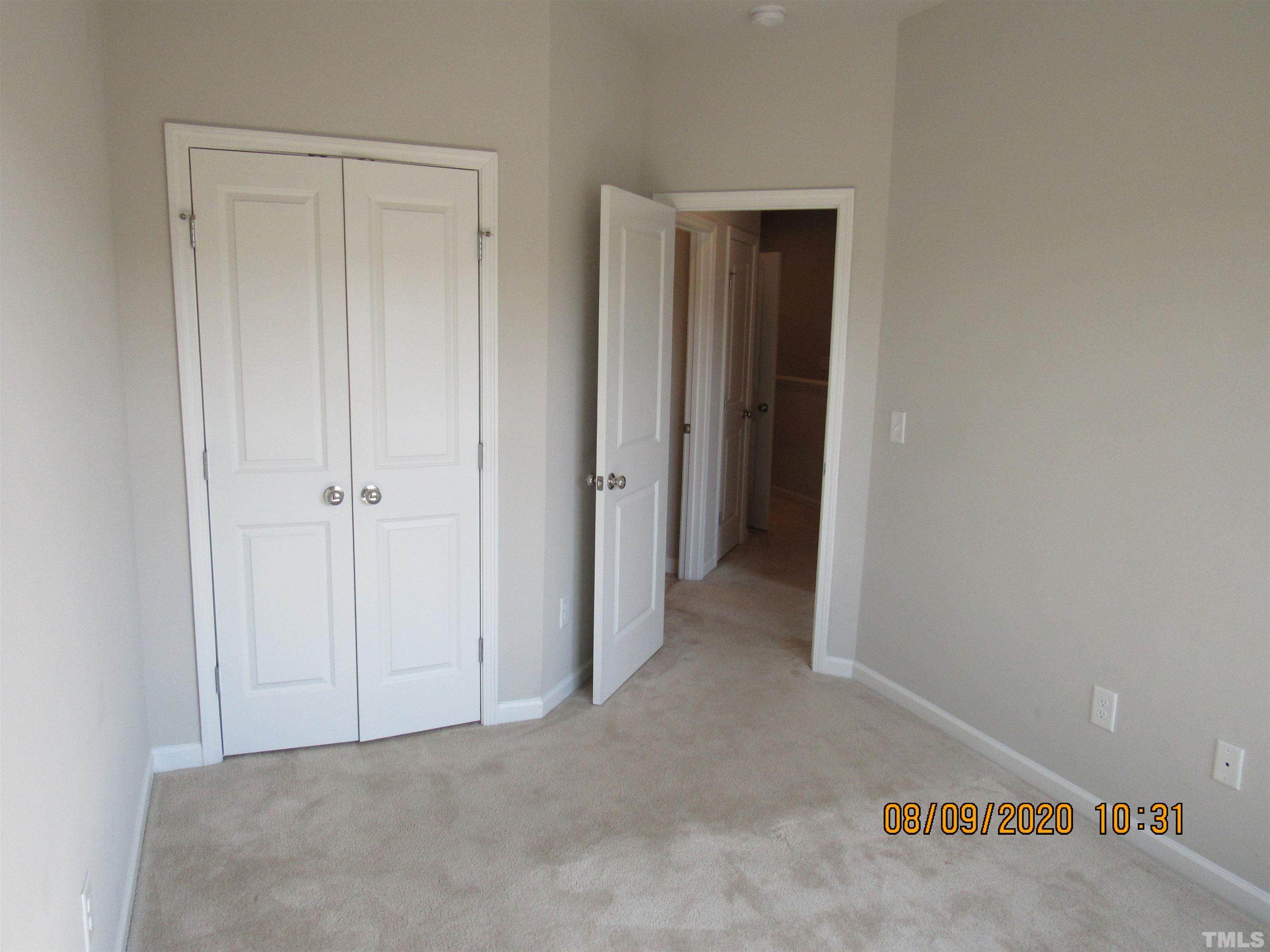a view of a hallway with closet area
