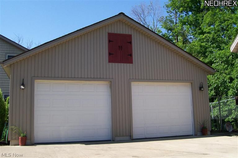 8960 North Brown Road Chardon, OH 44024 - Photo 2 of 23 Two car garage with seperate work area and man-door off back
