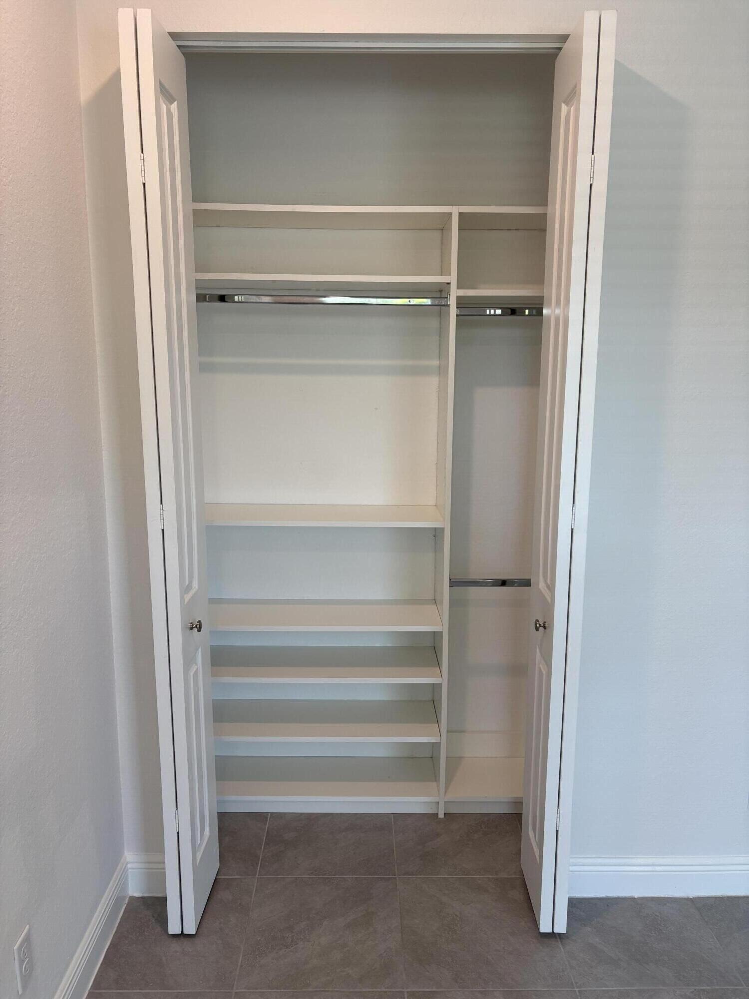 879 Ember Ridge Run Loxahatchee, FL 33470 - Photo 28 of 38 Guest bedroom closet