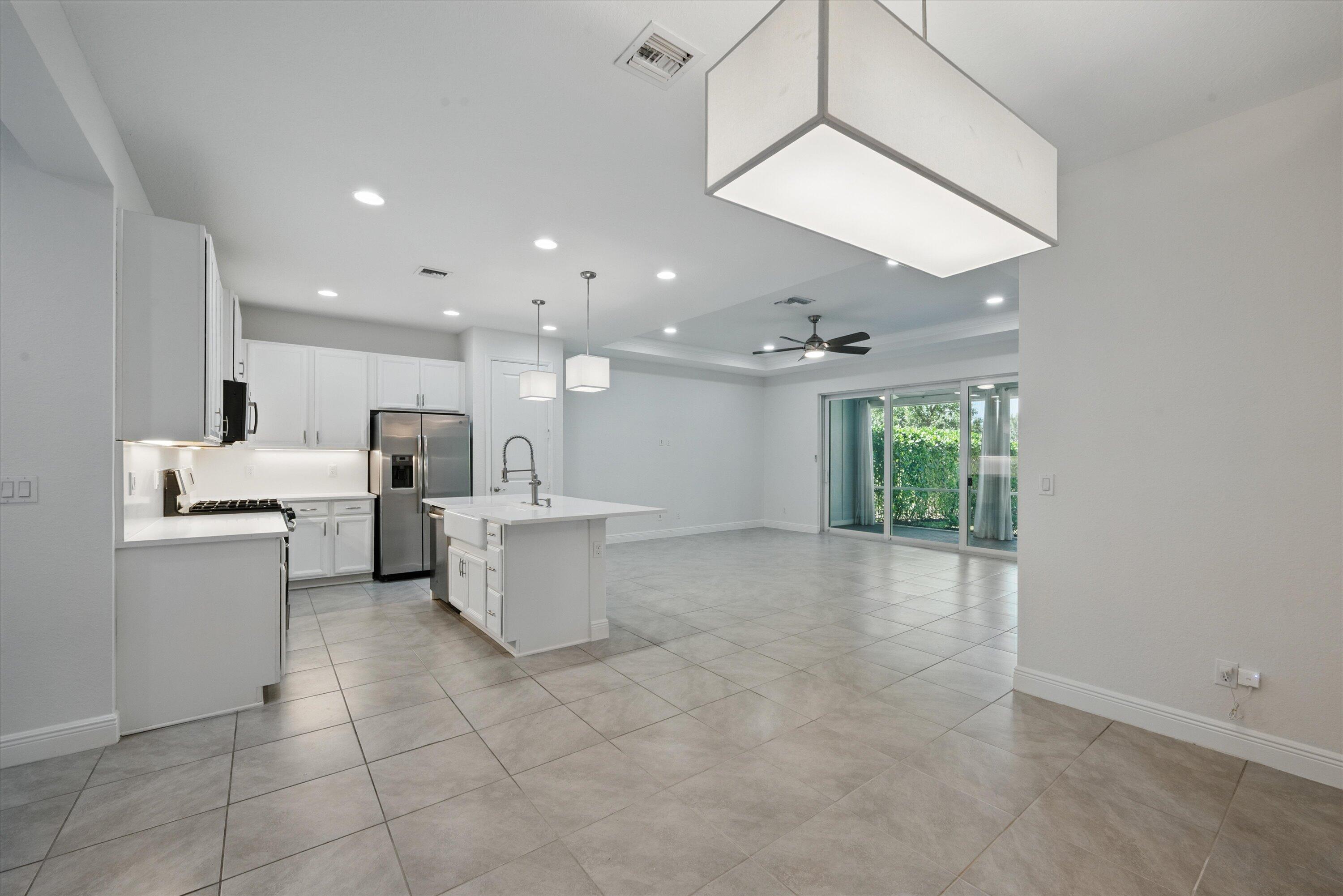 879 Ember Ridge Run Loxahatchee, FL 33470 - Photo 8 of 38 09-Dining to Kitchen