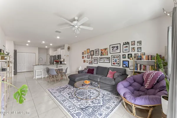 a living room with furniture and a rug