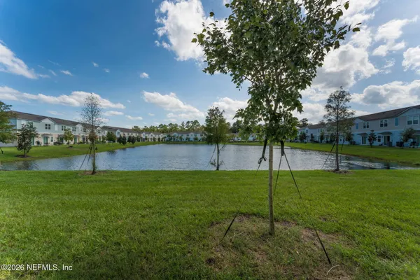 a view of a golf course with a lake