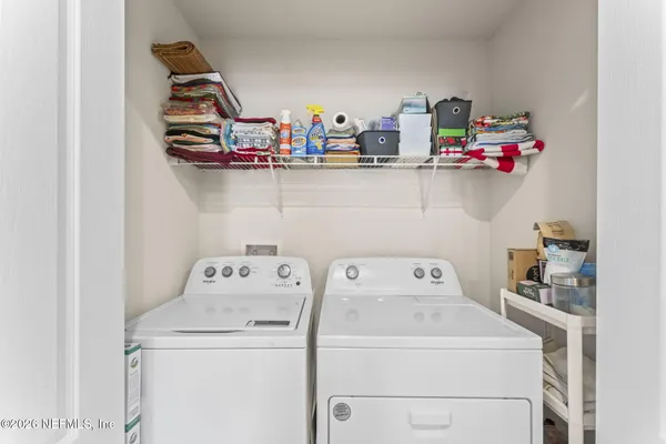 a utility room with dryer and washer