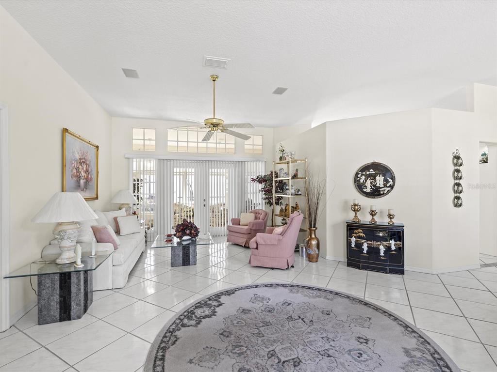 8704 Cypress Lakes Boulevard New Port Richey, FL 34653 - Photo 11 of 43 a living room with furniture