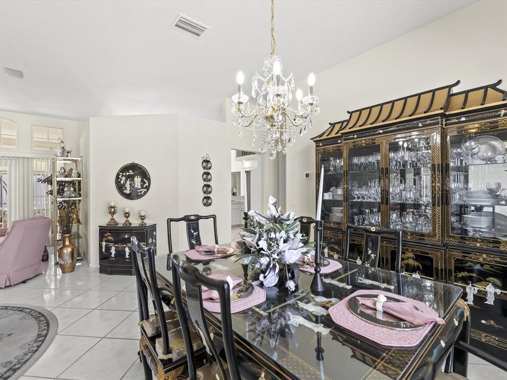 8704 Cypress Lakes Boulevard New Port Richey, FL 34653 - Photo 12 of 43 a view of a dining room with furniture window and outside view
