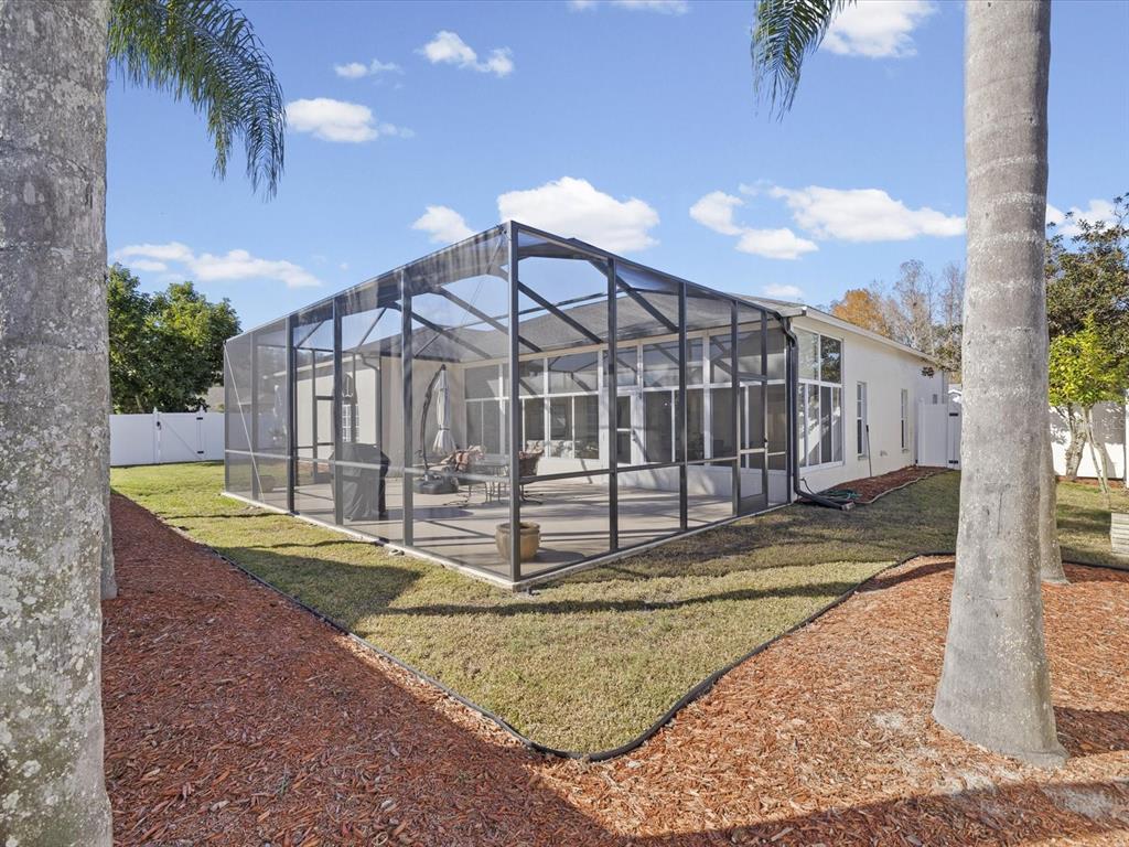 8704 Cypress Lakes Boulevard New Port Richey, FL 34653 - Photo 34 of 43 a view of a house with backyard
