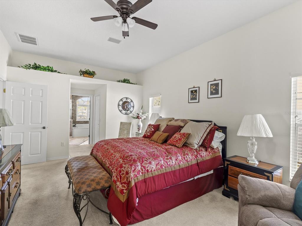 8704 Cypress Lakes Boulevard New Port Richey, FL 34653 - Photo 4 of 43 a bedroom with a bed and window