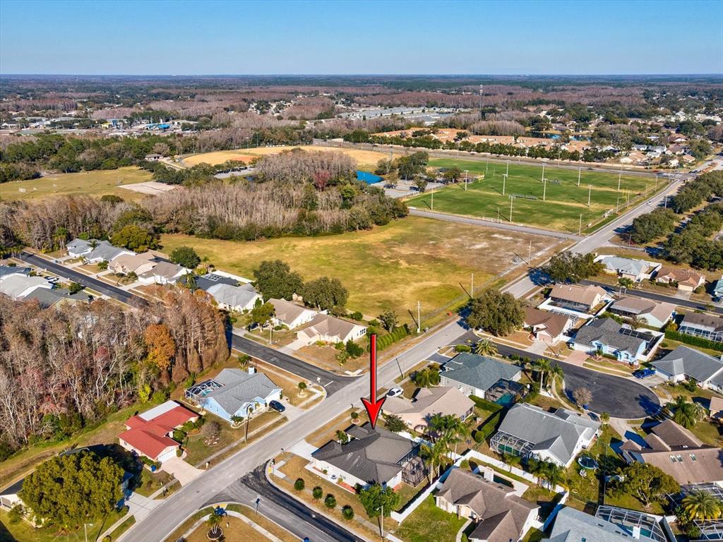 8704 Cypress Lakes Boulevard New Port Richey, FL 34653 - Photo 42 of 43 an aerial view of residential houses with outdoor space