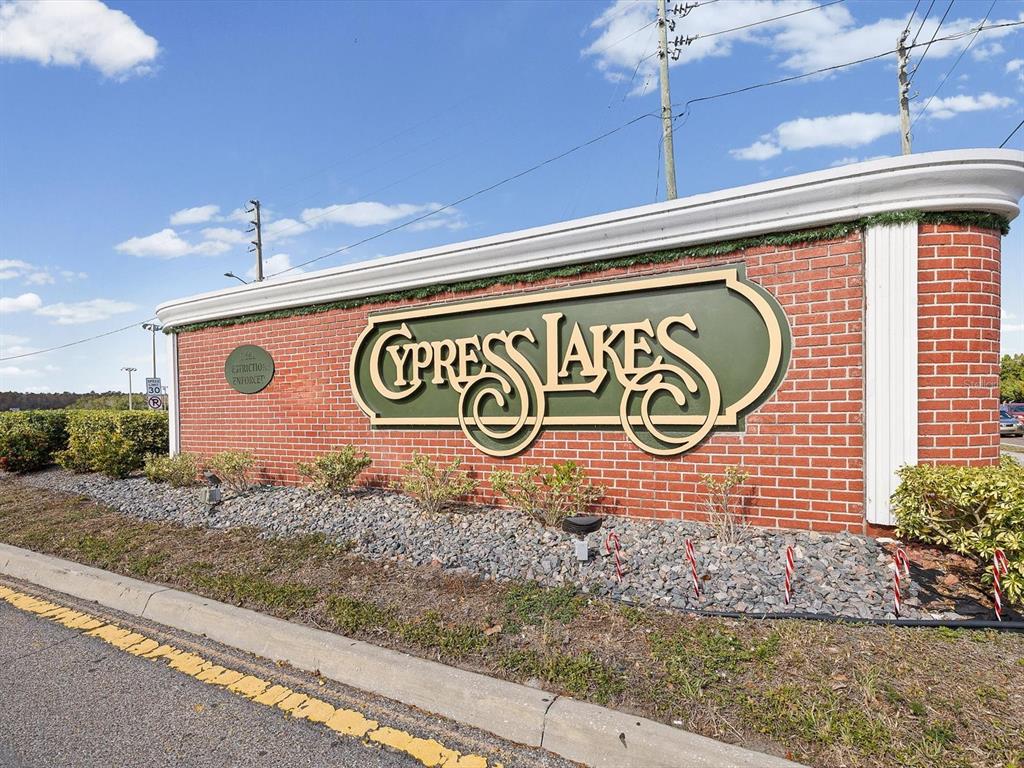 8704 Cypress Lakes Boulevard New Port Richey, FL 34653 - Photo 6 of 43 a sign that is on the side of a building