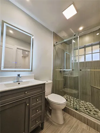 a view of a bathroom with shower and a window